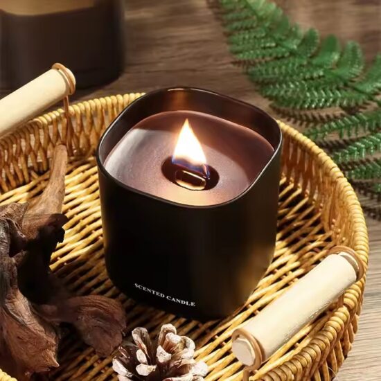 Soy wax scented candle with wooden wick in clear glass jar