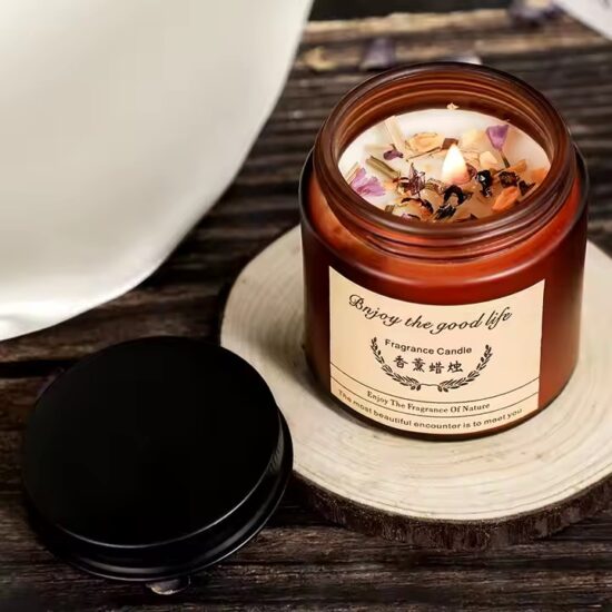 Luxury soy wax scented candle with dried flowers in glass jar