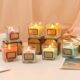 Christmas-themed scented candle in creative glass jar