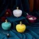 Multicolor soy wax scented candle in glass jar